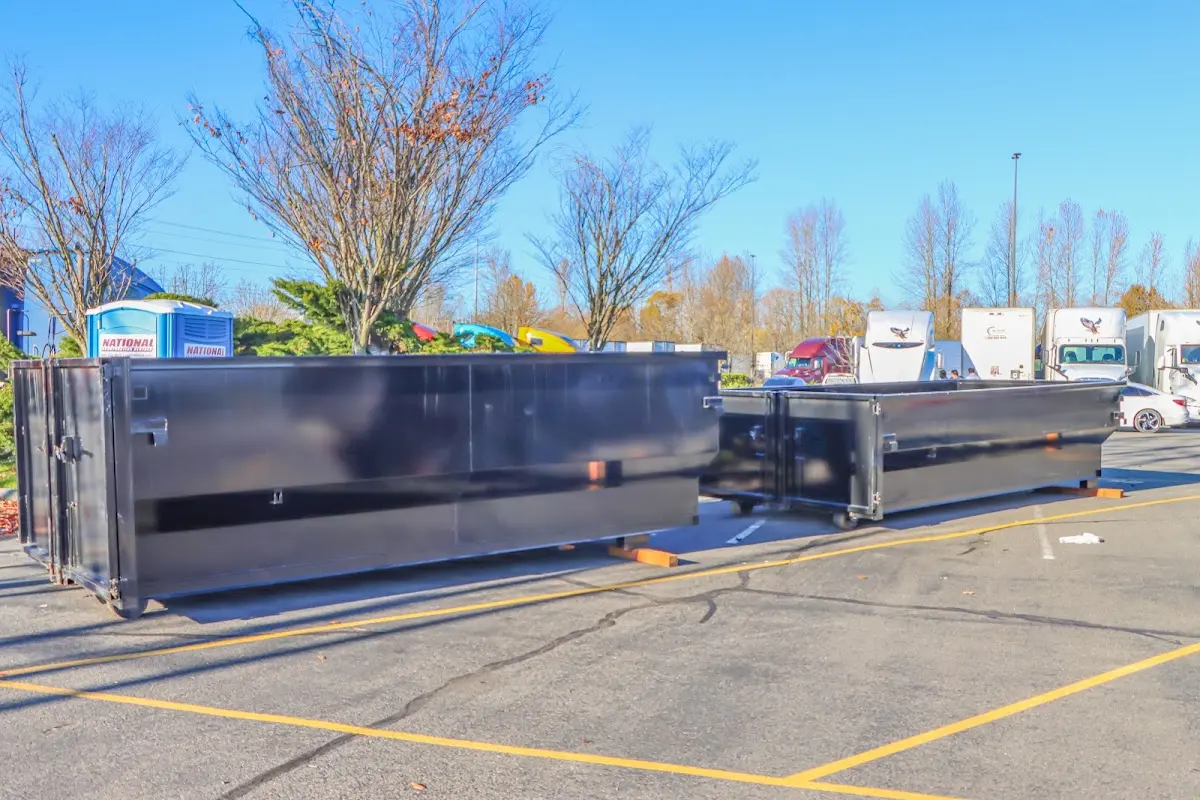 Professional dumpster rental service with roll-off container on residential driveway in Vestavia Hills